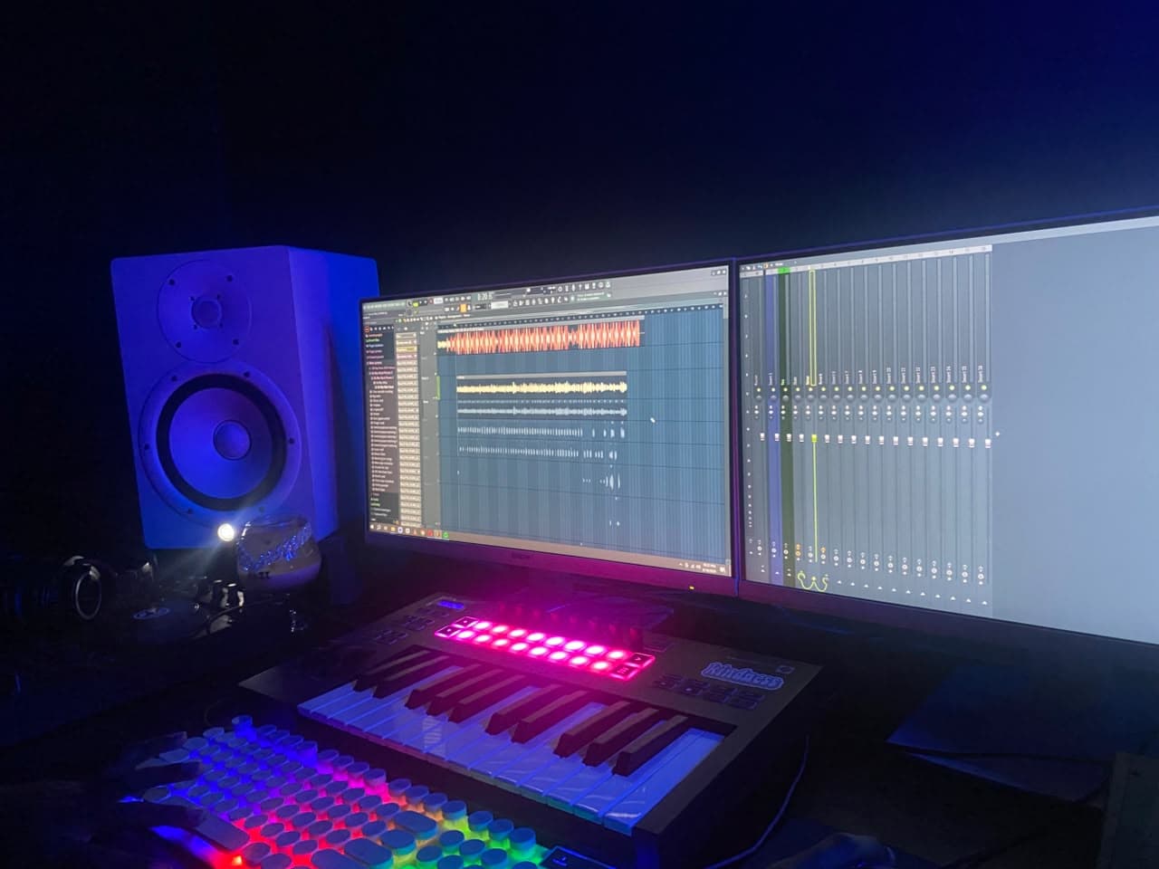 Mixing desk lit by purple studio lights