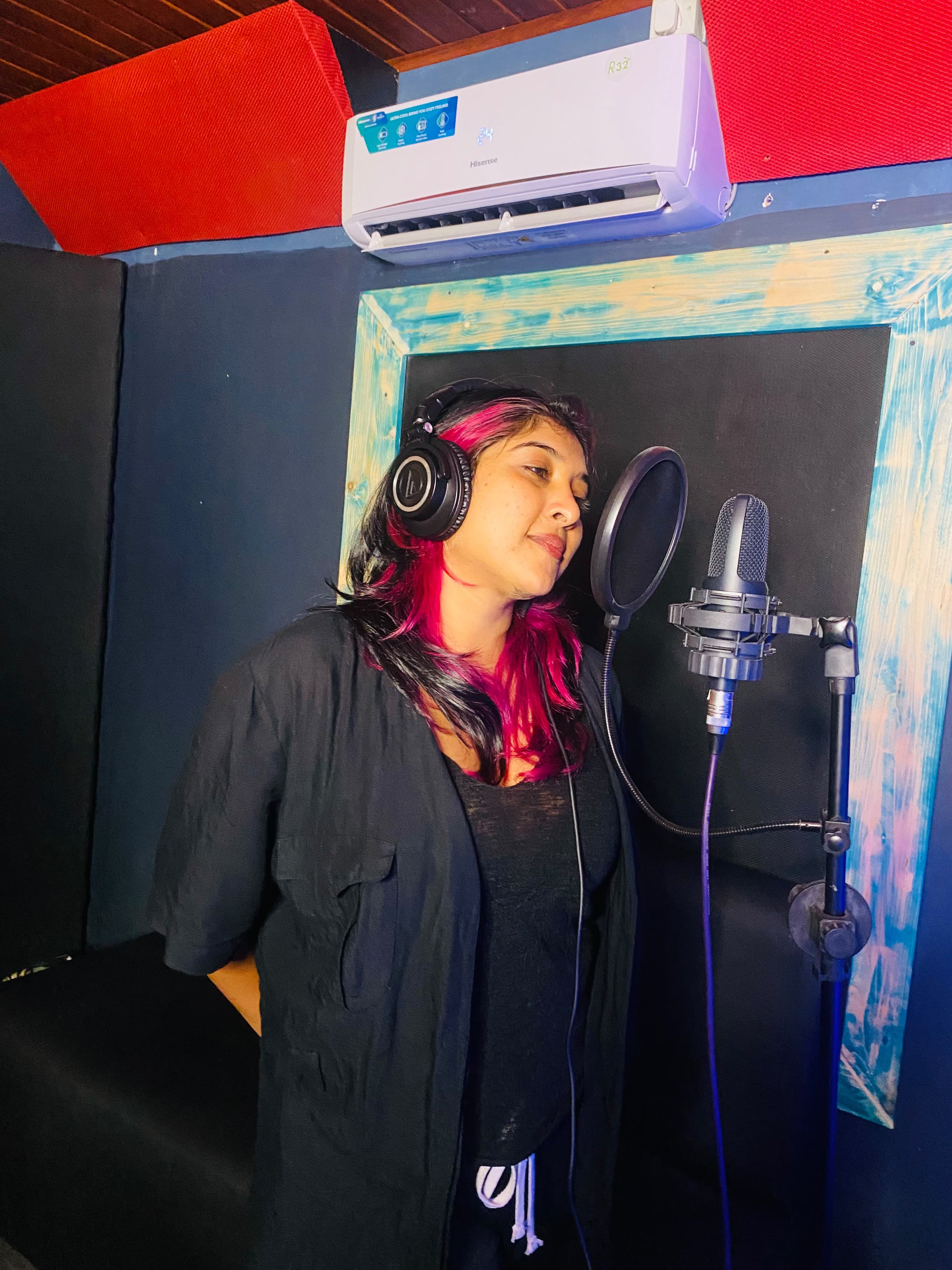 Vocalist recording at the studio microphone