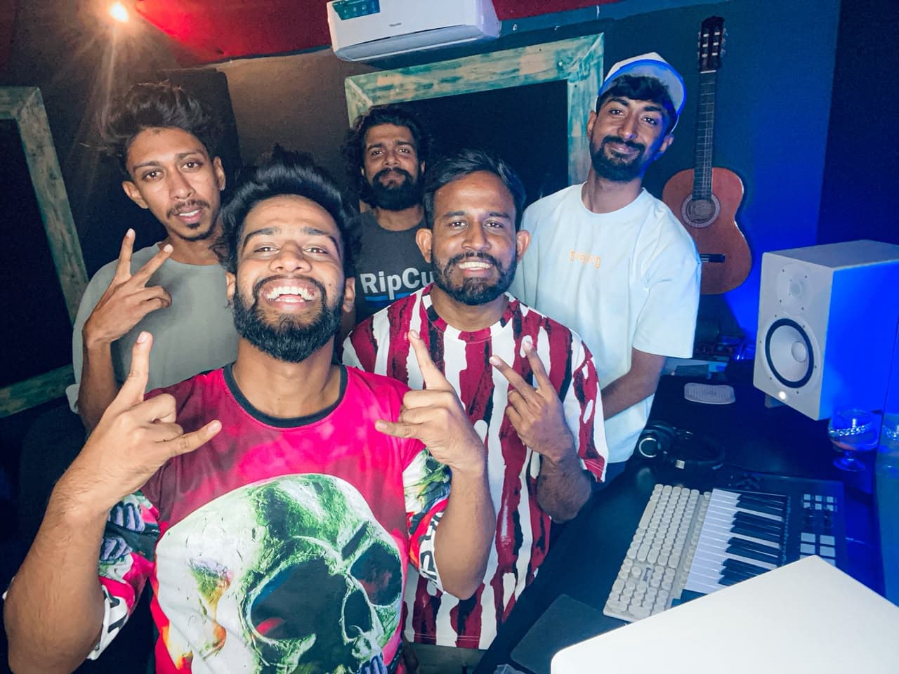 A group of artists together in the studio